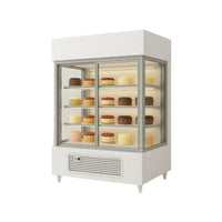 Refrigerated upright cake display case with glass doors and shelves, featuring LED lighting under each shelf and a sleek white body, shown from a slightly right-side angle against a very light grey background.