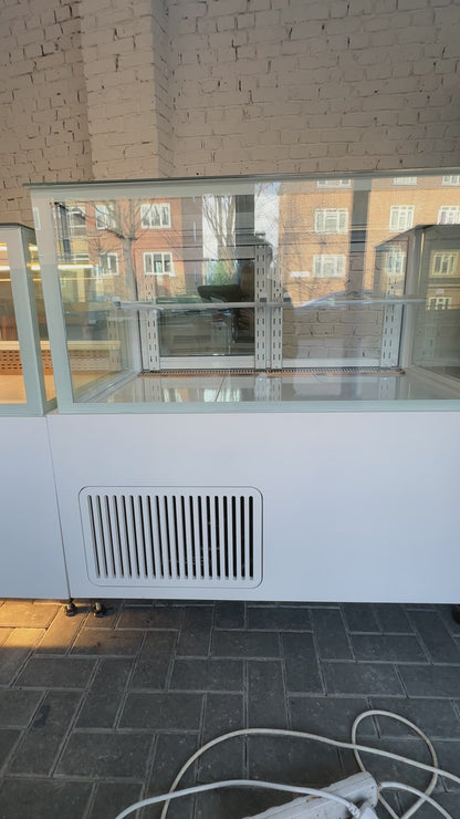 Cake and fresh food display fridge by Fridges World with open interior and LED lighting, ideal for cafés and delis.